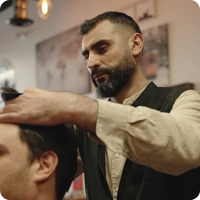 Barber styling a client